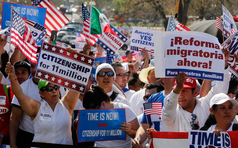 People rally for comprehensive immigration reform April 10 near the U.S. Capitol in Washington. (CNS/Reuters/Larry Downing)