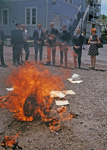 The Catonsville Nine burn draft records in Catonsville, Md., on May 17, 1968. (Newscom/Dennis Brack)