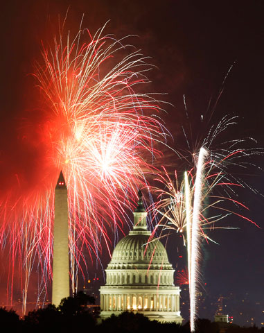 Fireworks light up the sky around the U.S. Capitol and Washington Monument  on Independence Day in 2012. (CNS/Reuters)