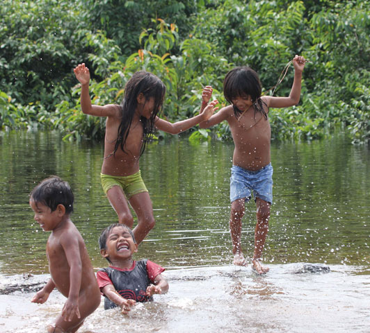 Urarina children play in the water on a hot afternoon in the community of Santa Lucía in Peru. (Photos by Barbara Fraser)