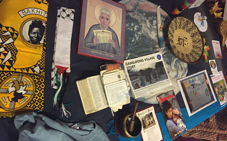 A variety of peace symbols from around the world at the prayer table at the Nonviolence and Just Peace conference, April 2016 (Judy Coode)