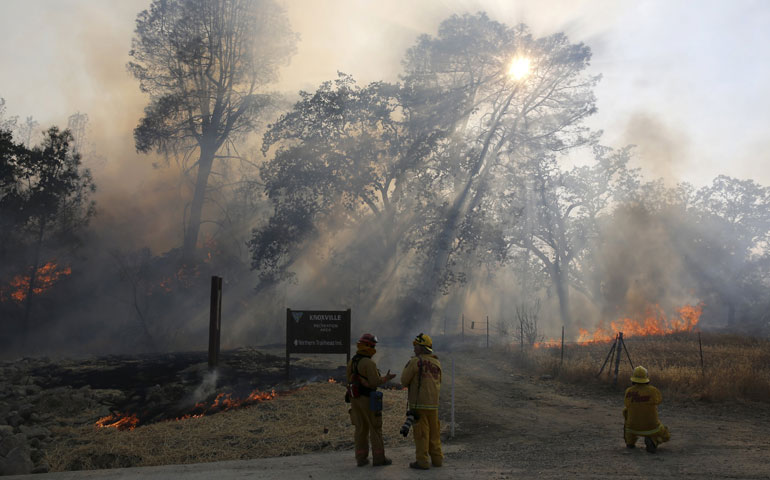 Firefighters look on during the Jerusalem Fire in Lake County, Calif., Aug. 12. (CNS/Reuters/Robert Galbraith)
