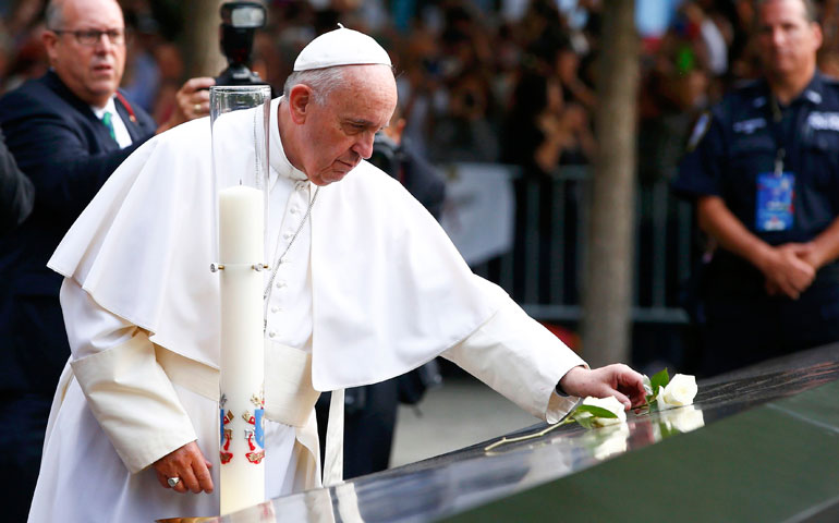 Pope Francis places a rose at the South Pool of the National 9/11 Memorial and Museum Sept. 25, 2015, in New York. (CNS/Tony Gentile)