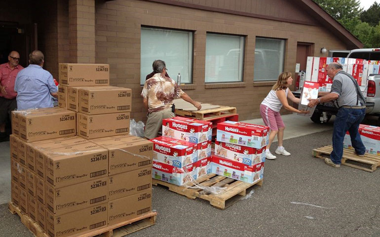 Volunteers at the Tri-Cities Diaper Bank in Yakima, Wash., unload pallets of diapers that will be repackaged and distributed to families in need. (Courtesy of Tri-Cities Diaper Bank)