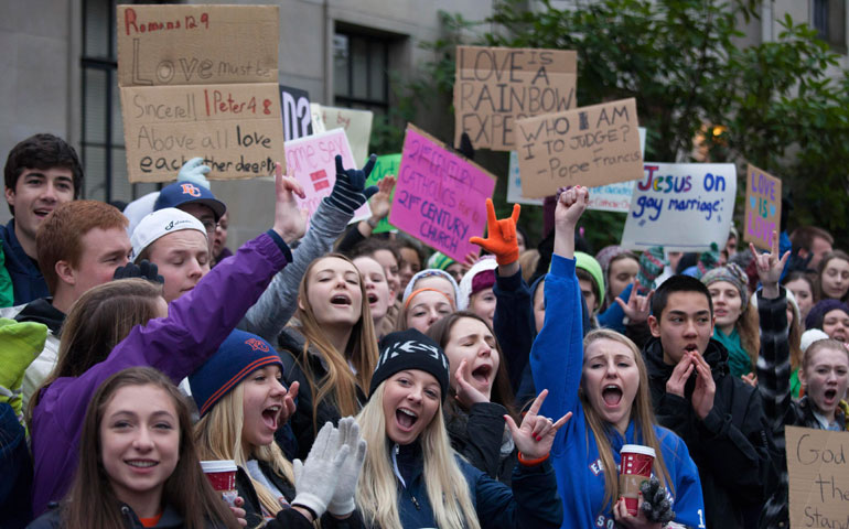 Eastside Catholic High School students rally in support of former Vice Principal Mark Zmuda at the Seattle archdiocese chancery building Dec. 20, 2013. Zmuda was asked to resign because he married his same-sex partner. (Reuters/David Ryder)
