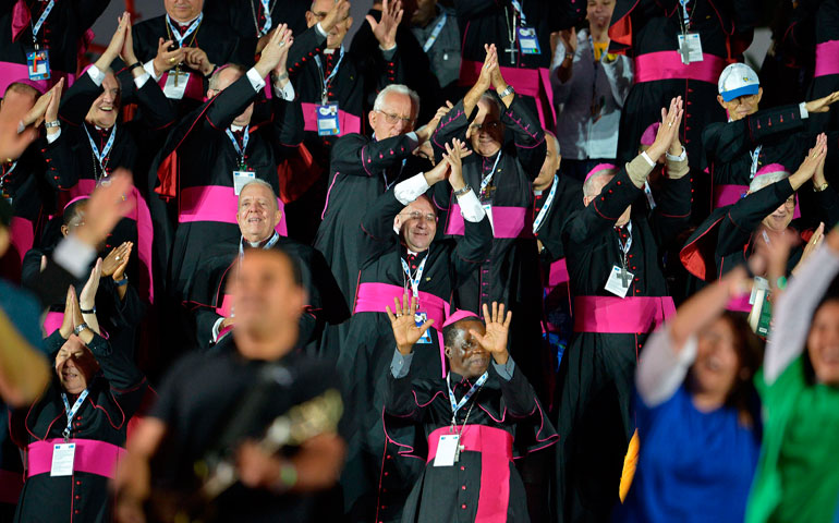 On July 27, bishops join the rehearsal of the dance to welcome Pope Francis at Copacabana beach in Rio de Janeiro during World Youth Day. (Getty Images/AFP Photo/Gabriel Bouys)