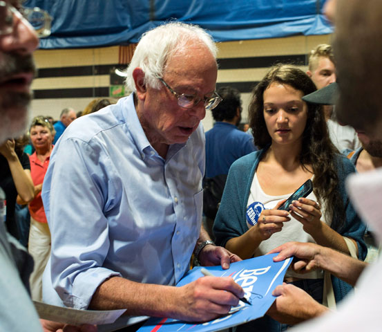 Sen. Bernie Sanders signs autographs during a town hall meeting in Conway, N.H., Aug. 24. (Newscom/EPA/CJ Gunther)