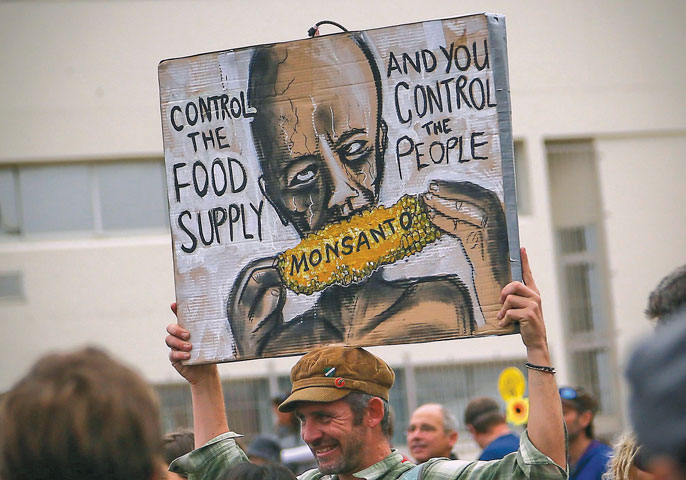 South African activists protest Monsanto and genetically modified organisms in Cape Town May 25. (Newscom/EPA/Nic Bothma)