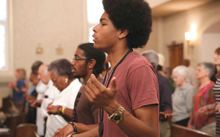 At Holy Redeemer Catholic Church in Washington Aug. 25, people gather for a Mass that was part of a celebration marking the 50th anniversary of the March on Washington. Co- Sponsored by Pax Christi USA, the anniversary event included a discussion on race, religion and the legacy of the 1963 civil rights march. (CNS/Nancy Phelan Wiechec)