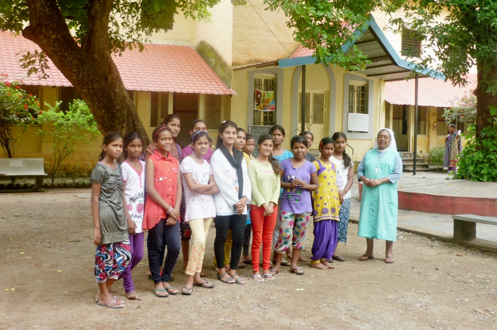 Some of the boarders with their director, Sr. Georgina Jose, in front of Maria Niwas in Nagpur, central India. (Lissy Maruthanakuzhy)