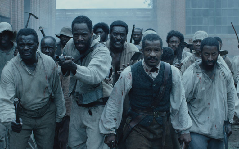 Nate Parker, second from right, as Nat Turner in "The Birth of a Nation" (Photos by Fox Searchlight Pictures)