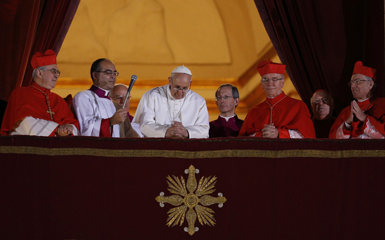 Pope Francis asks people to pray for him as he appears for the first time on the central balcony of St. Peter's Basilica on March 13 at the Vatican. (CNS/Paul Haring) 