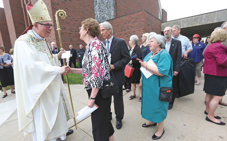 Archbishop Michael Jackels greets people after being installed as head of the archdiocese of Dubuque, Iowa, at the Church of the Nativity May 30. (AP/The Telegraph Herald/Jessica Reilly)