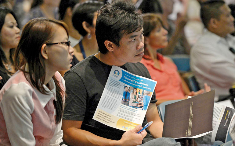 Town hall attendees listen to speakers at a community forum on the Affordable Care Act in Long Beach, Calif., Sept. 6. (CNS/Reuters/Kevork Djansezian)
