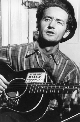 Woody Guthrie performs on March 8, 1943. (Newscom/Reuters/Woody Guthrie Archives/Al Aumuller)