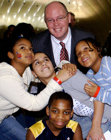 Kevin Ryan, president of Covenant House, is pictured with Covenant House children in this undated photo. (CNS/Covenant House)