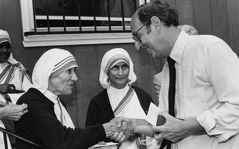 Mother Teresa shakes hands with Colman McCarthy in June 1985. (The Washington Post/Harry Naltchayn)