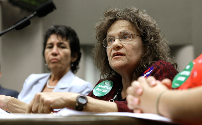 Marilyn Golden, right, urges California lawmakers reject right-to-die legislation at the Capitol Sept. 1 in Sacramento. The bill passed Sept. 11 and Gov. Jerry Brown signed it into law Oct. 5. (AP Photo/Rich Pedroncelli)