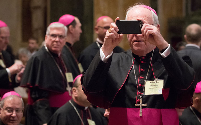 Bishop Richard Malone of Buffalo, N.Y., snaps a photograph before a prayer and meeting with Pope Francis at the Cathedral of St. Matthew the Apostle in Washington Sept. 23. (CNS/St. Louis Review/Lisa Johnston)