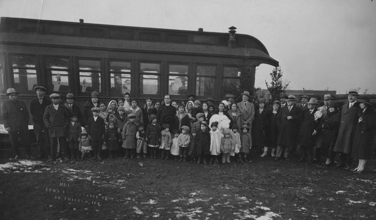 A photo from the Claretian archives shows Claretian Fr. James Tort, center, with the Catholic Instruction League at a boxcar camp in December 1926. (Claretian Missionaries Archives, Chicago)