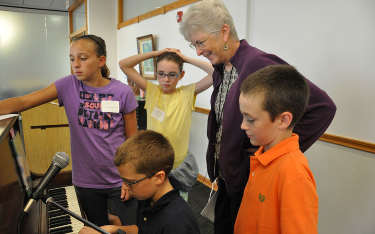 St. Joseph Sr. Kathy Sherman helps students during a September Artists of Peace field trip at The Well Spirituality Center in La Grange Park, Ill.