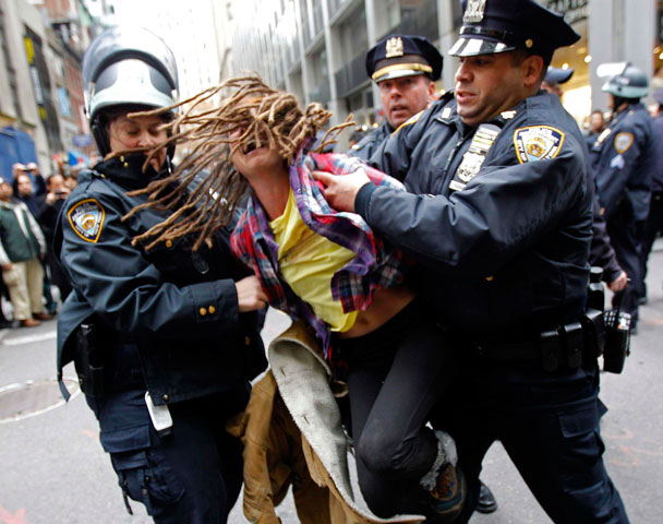 An Occupy Wall Street demonstrator is arrested by New York City Police in November 2011. (CNS/Reuters/Mike Segar)