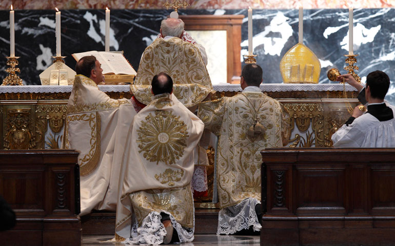 Cardinal Walter Brandmuller elevates the Eucharist during a Tridentine-rite Mass at the Altar of the Chair in St. Peter’s Basilica at the Vatican May 15, 2011. (CNS/Paul Haring)