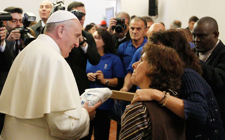 Pope Francis meets with poor people in early October at the archbishop's residence in Assisi, Italy. (CNS/Paul Haring)