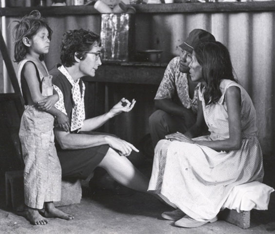 Maryknoll Sr. Maura Clarke, second from left, with a family in Nicaragua in an undated photo (Maryknoll Mission Archives)