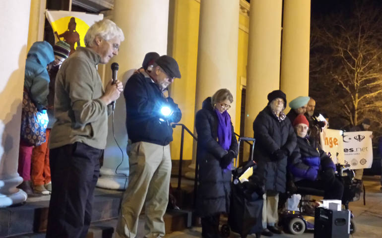 Close to 100 people attended a #LightsforLima vigil Dec. 7 outside St. John's Episcopal Church in Washington. The vigils, nearly 50 worldwide, prayed that U.N. negotiations in Lima, Peru produce an internationally binding climate agreement. (Franciscan Action Network) 
