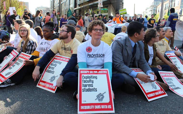 Supporters of unionization of adjunct faculty at Seattle University stage a sit-in April 15 on a street north of the Jesuit campus. More than 20 people were arrested for civil disobedience. (SEIU 925)