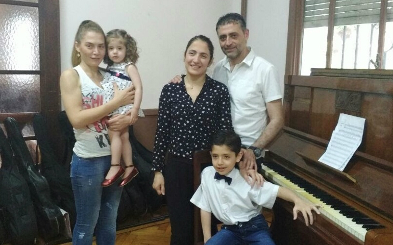 Fadi Ali, far right, stands next to his wife, Hanan, with his children and sister-in-law. (Provided photo)