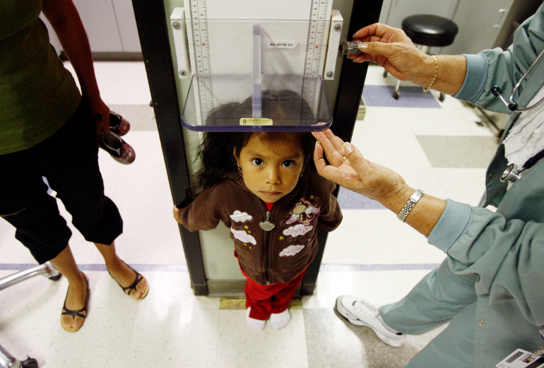 Uninsured patient Donaji Cruz, 3, has her height measured during a health checkup at Venice Family Clinic in Venice, Calif., in this June 25, 2009, file photo. (CNS/Reuters/ Lucy Nicholson)