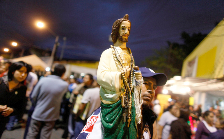 A man carries a statue of St. Jude outside a church in Monterrey, Mexico. (CNS/Reuters/Tomas Bravo) 