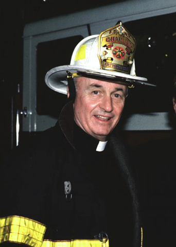 Franciscan Fr. Mychal Judge, a chaplain with the New York Fire Department, is pictured in an undated photo wearing his helmet and bunker coat. Judge died while giving last rites to a firefighter in the aftermath of the terrorist attacks that brought down the twin towers of the World Trade Center. (CNS/courtesy Holy Name Province Franciscans) 
