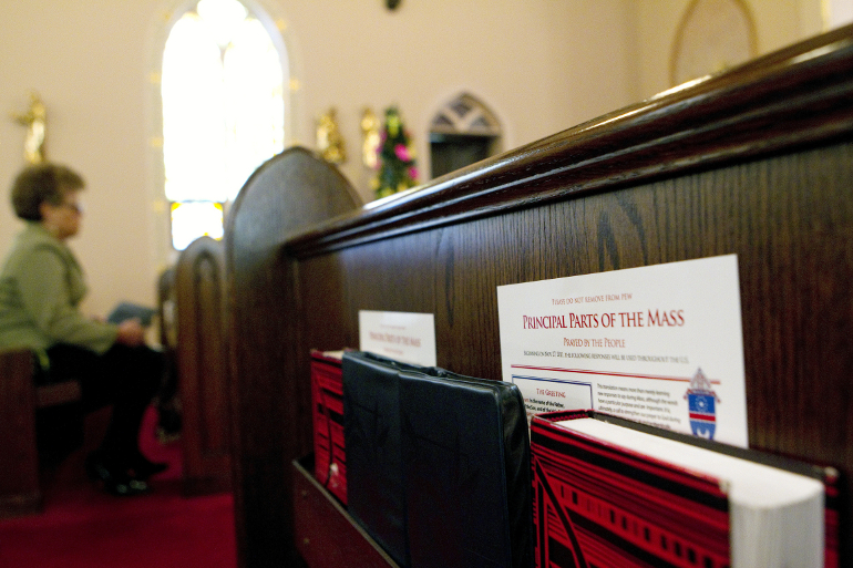 A guide to the new wording in the Mass is pictured in a pew prior to Sunday service at St. Joseph's Catholic Church in Alexandria, Va., in 2011. (CNS photo/Nancy Phelan Wiechec)