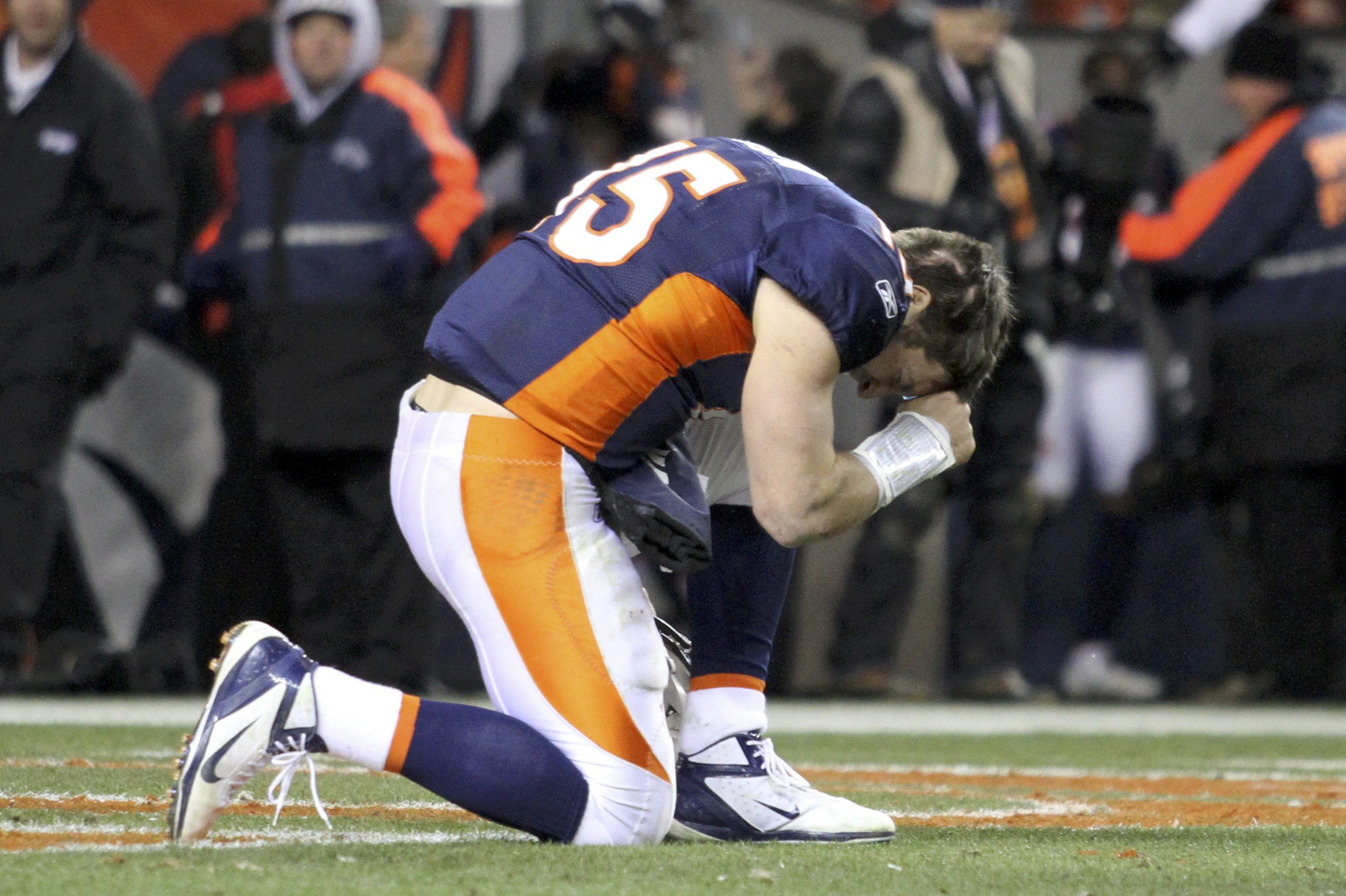 Denver Broncos quarterback Tim Tebow prays after the Broncos defeated the Pittsburgh Steelers in overtime in the National Football League AFC wild-card playoff game in Denver Jan. 8. The Broncos won 29-23, leading them to a face-off with the New England Patriots Jan. 14. (CNS photo/Marc Piscotty, Reuters)