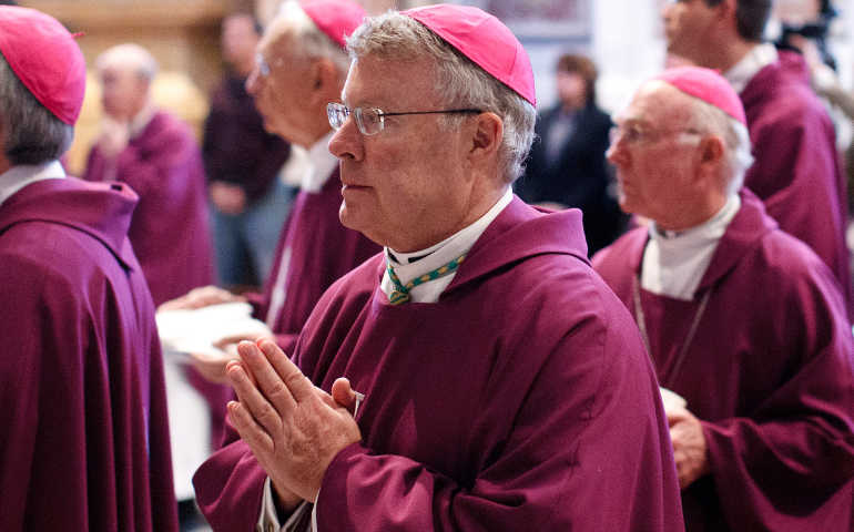Bishop R. Walker Nickless of Sioux City, Iowa, concelebrates Mass March 12 with bishops from Iowa, Nebraska, Kansas and Missouri at the tomb of Blessed John Paul II in St. Peter's Basilica during "ad limina" visits to the Vatican. (CNS photo/Paul Haring)
