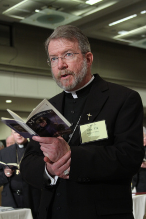 Bishop Liam S. Cary of Baker, Ore., prays June 13, 2013 during the mid-year meeting of the U.S. Conference of Catholic Bishops in Atlanta. (CNS/Georgia Bulletin/Michael Alexander)