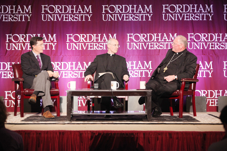Political satirist Stephen Colbert, Jesuit Fr. James Martin, moderator, and New York Cardinal Timothy Dolan are seen during a conversation about humor, faith, joy and the spiritual life Sept. 14, 2012, at Fordham University, New York. (CNS/Courtesy Fordham University/Bruce Gilbert)