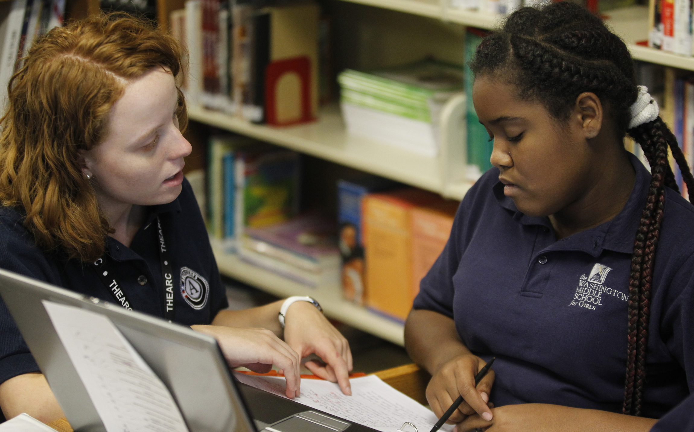 Kaitlin Walker works with student Empress Mondesire at the Washington Middle School for Girls in Washington Sept. 19, 2012, during Walker's first year of service for Notre Dame Mission Volunteers-AmeriCorps. (CNS/Bob Roller)  