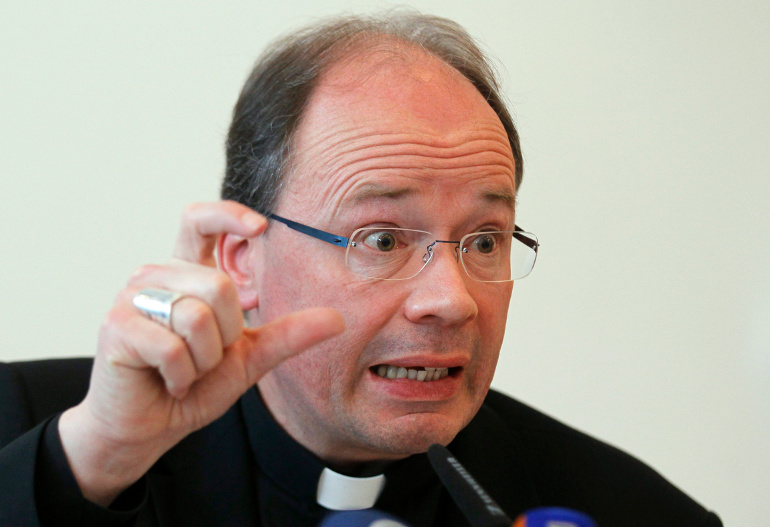 Bishop Stephan Ackermann of Trier, Germany, a representative of the German bishops' commission for the investigation of allegations of sexual abuse of minors, gestures during a Jan. 17, 2013 press conference in Trier. (CNS/Reuters/Wolfgang Rattay)