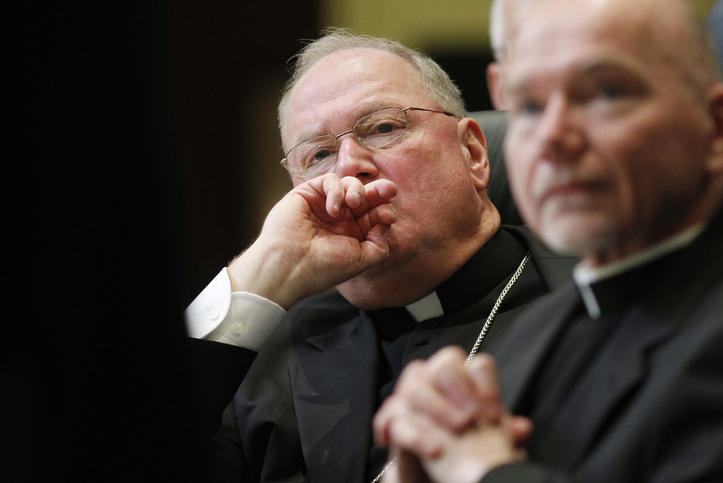 New York Cardinal Timothy M. Dolan listens to proceedings of the U.S. bishops' meeting in November in Baltimore. Cardinal Dolan, president of the U.S. Conference of Catholic Bishops, said in a Feb. 7 statement that the government's new set of proposed rules on insurance coverage of contraceptives falls short in meeting concerns of the church. (CNS photo/Nancy Phelan Wiechec)