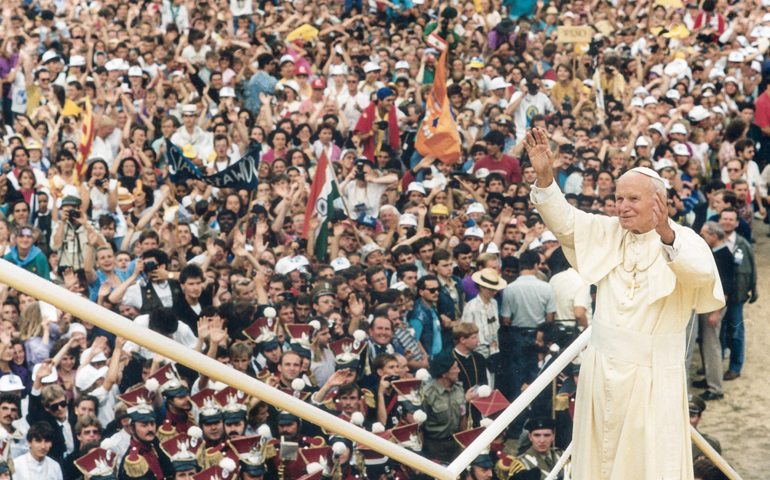 Pope John Paul II greets the World Youth Day crowd in Czestochowa, Poland, in 1992. (CNS file photo) 