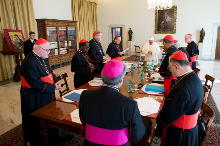 Pope Francis prays during a meeting with cardinals at the Vatican Oct. 1, 2013. (CNS/Reuters/L'Osservatore Romano)