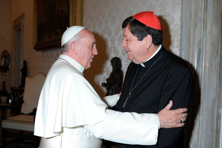 Pope Francis greets Brazilian Cardinal Joao Braz de Aviz, prefect of the Congregation for Institutes of Consecrated Life and Societies of Apostolic Life, during a private audience at the Vatican Oct. 5, 2013. (CNS/Reuters/L'Osservatore Romano)