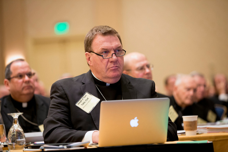 Archbishop Joseph W. Tobin of Indianapolis listens during the opening session of the fall meeting of the U.S. Conference of Catholic Bishops Nov. 11, 2013, in Baltimore. (CNS/Nancy Phelan Wiechec) 
