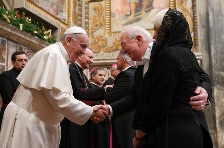 Pope Francis exchanges greetings with Ken Hackett, U.S. ambassador to the Holy See, and his wife, Joan, during a meeting with ambassadors to the Holy See at the Vatican Jan. 13,, 2014. (CNS photo/Paul Haring)