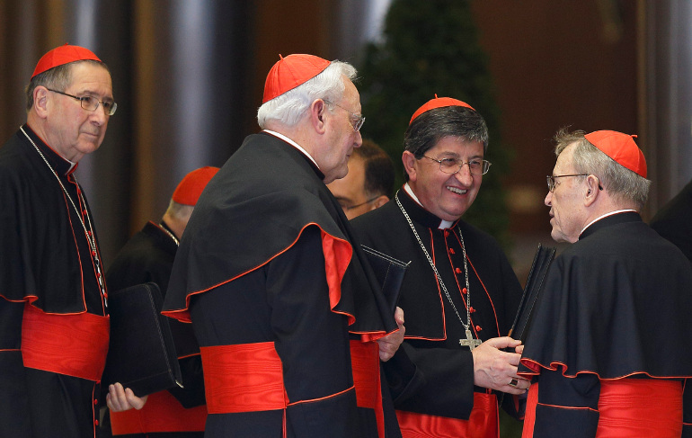 German Cardinal Walter Kasper, right, speaks with cardinals as they arrive for the afternoon session of a meeting with Pope Francis in the synod hall at the Vatican Feb. 21. Also pictured are Cardinals Roger M. Mahony, retired archbishop of Los Angeles, left, Carlos Amigo Vallejo, retired archbishop of Seville, Spain, and Giuseppe Betori of Florence. (CNS/Paul Haring)