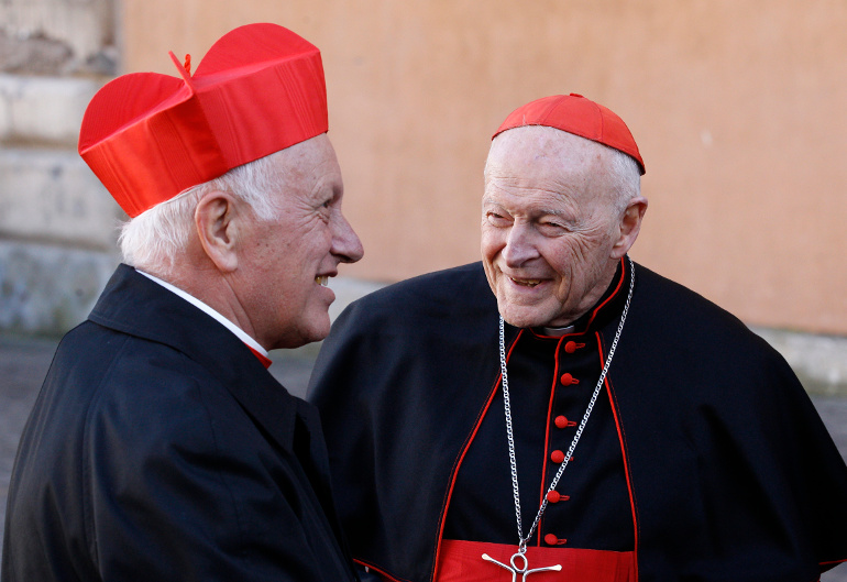 Cardinal Ricardo Ezzati Andrello of Santiago, Chile, left, talks with Cardinal Theodore E. McCarrick, retired archbishop of Washington, during a reception for new cardinals at the Vatican Feb. 22. (CNS/Paul Haring)